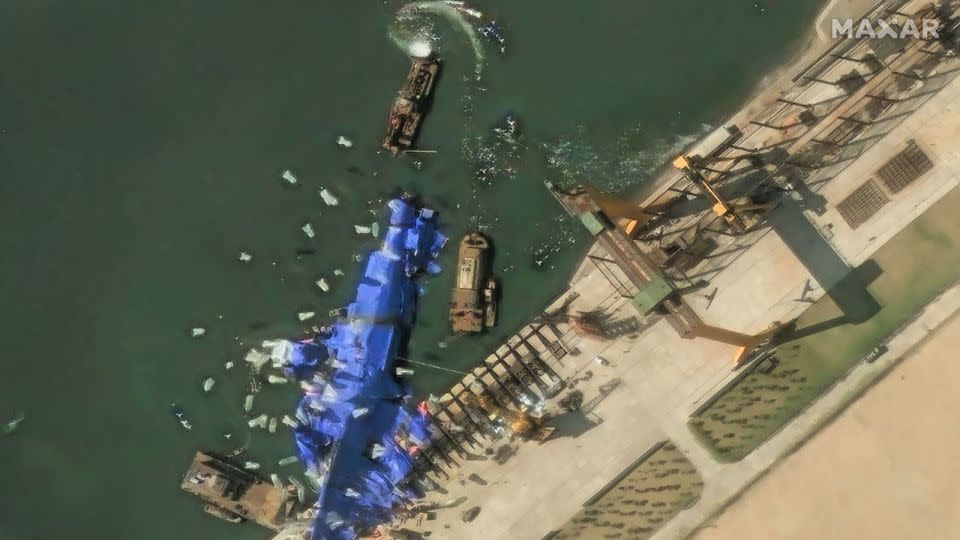 Maxar imagery shows continued efforts to conceal the damaged destroyer at Hambuk Shipyard one day after the failed launch. - Maxar/DigitalGlobe/Getty Images