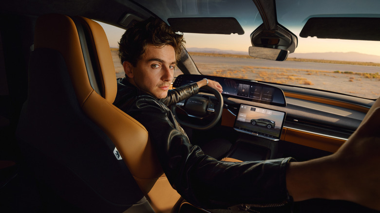 Timothee Chalamet at the wheel of a Lucid Gravity SUV