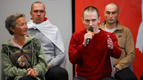 Reuters Mikalai Dziadok, one of the prisoners recently released from Belarus, speaks during a press conference 