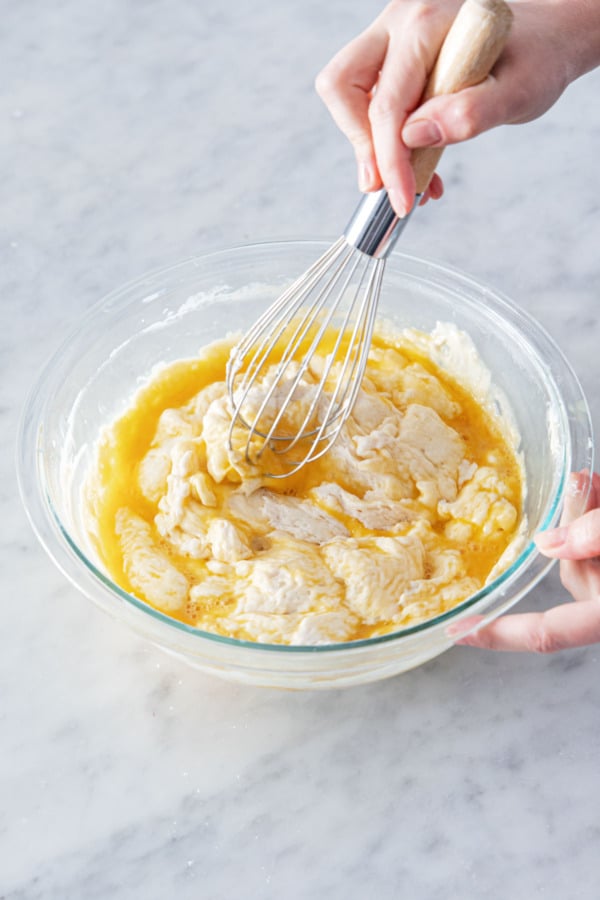 Use a whisk to fold and stir until eggs are fully incorporated.