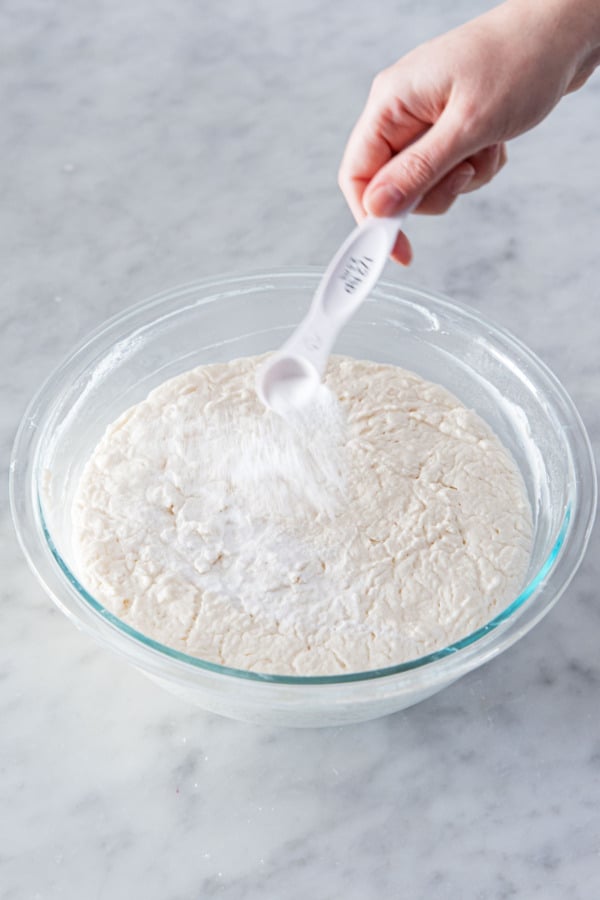 Adding baking soda and salt to waffle batter before baking.